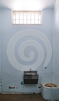 Old prison cell with barred window