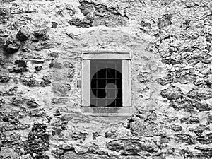 Old prison jail window with rusty metal bars. Vintage style image