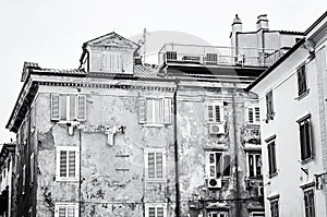 Old private houses in Piran, Slovenia, colorless