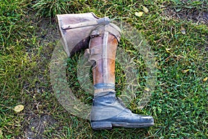 old prosthetic leg laying on grass