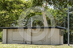 Old Public Bathroom Under Shady Trees