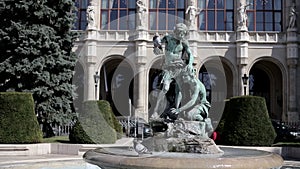 Old public fountain of two boys and pigeons in Budapest