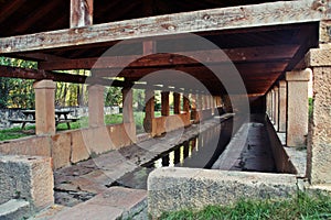 The old public laundry with clear freshwater in Sepulveda, Segovia, Spain. `Prohibido lavar coches` translation `No Car washing`. photo