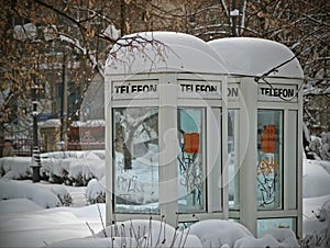 Old public phone cabin at winter photo