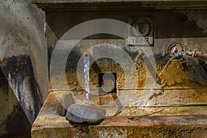 Old Public Water Fountain in Tris Elies village in Troodos, Cypr photo