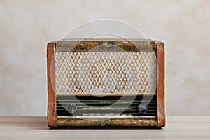 Old radio against wall background