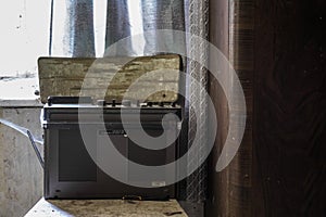 old radio on an armchair in a room from a house