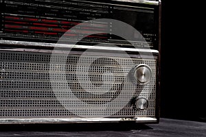 Old radio on black background