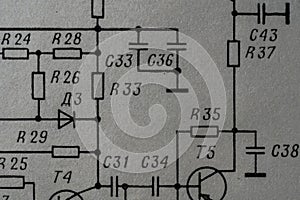 Old radio circuit printed on vintage paper electricity diagram as background. Electric radio scheme from USSR