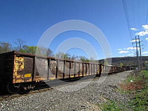 Old rail road cars passing by.
