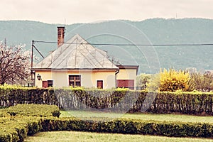 Old rail station in the natural landscape, yellow filter