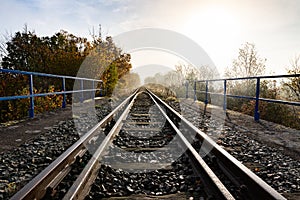 Old railroad tracks leading through the bridge. Railway line in Central Europe