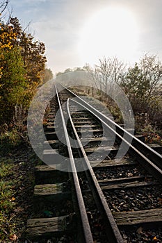 Old railroad tracks leading through the bridge. Railway line in Central Europe