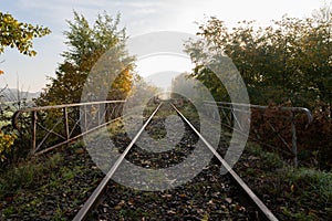 Old railroad tracks leading through the bridge. Railway line in Central Europe