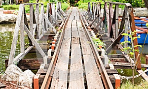 Old railroad tracks made of steel and wood.