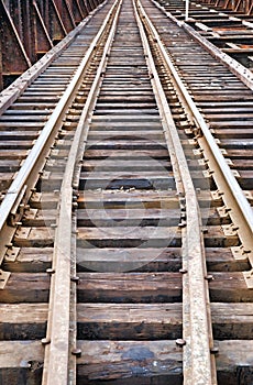 Old railroad tracks on metal bridge