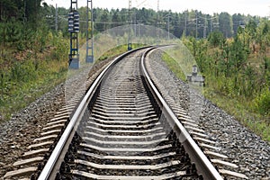 Old rails in landscape. Rails in the land.