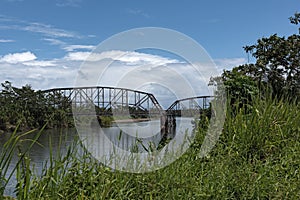 Old railway and border bridge across the Sixaola River between Costa Rica and Panama