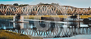 Old railway bridge over the Odra River. The metal openwork structure allows crossing to the other shore