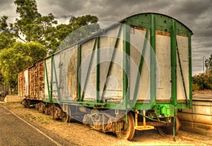 Old railway carriage stock car at platform