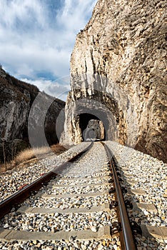 Old railway passing through short tunnels