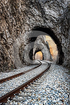 Old railway passing through short tunnels