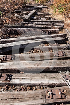 Old railway, railroad, rail track , abandoned, destroyed and overgrown wood