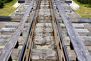 The old railway. Wooden sleepers. Steel rails