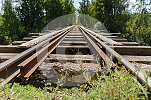 The old railway. Wooden sleepers. Steel rails