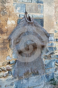 Old raincoat hangs outside a home, Duxu Ancient Town Guilin