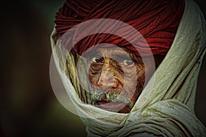 Old Rajasthani man with red turban.Festival-Pushkar