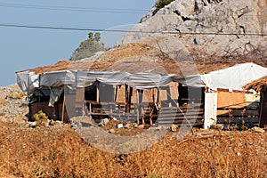 Old ramshackle cabins, temporary houses, derelict huts of poor homeless people