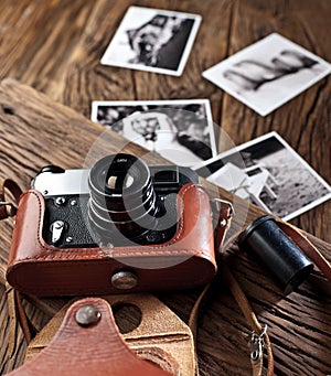 Old rangefinder camera and black-and-white photos.