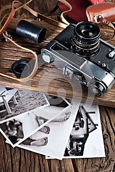 Old rangefinder camera and black-and-white photos.