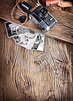 Old rangefinder camera and black-and-white photos.