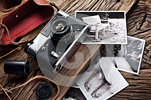 Old rangefinder camera and black-and-white photos.