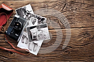 Old rangefinder camera and black-and-white photos. photo