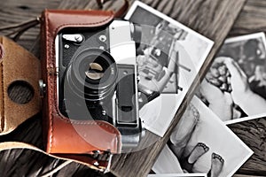 Old rangefinder camera and black-and-white photos.