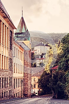 Old real school in mining town Banska Stiavnica, red filter