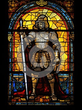 Old Realistic Stained Glass Window with the image of a knight