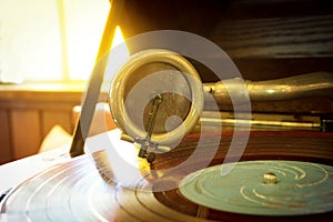 Old record player stylus on a rotating disc,music tools.