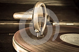 Old record player stylus on a rotating disc