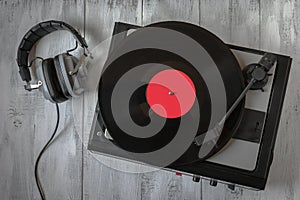 Old record player for vinyl records and headphones