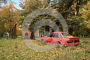 old red abandoned car