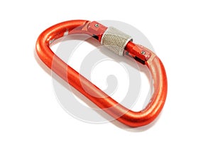 Old red aluminium alpinist carabiner isolated photo