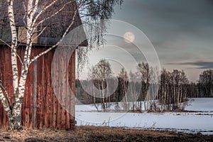 Old red barn in a countryside landscape