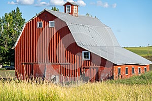 Old red barn in a field in the Palouse region of Washington State