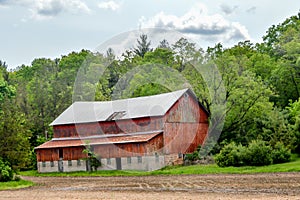 Old Red Barn Nestled in Forest in Wisconsin