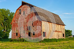 Old red barn at sunset