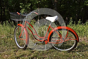 Re-conditioned old red bicycle photo